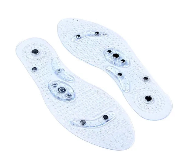 Transparent magnetic massage insole with silicone elastomer, visible magnets and massage nubs, on white background