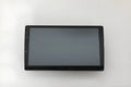 Black universal 10.1 inch Android car stereo touchscreen head unit with trapezoid panel
