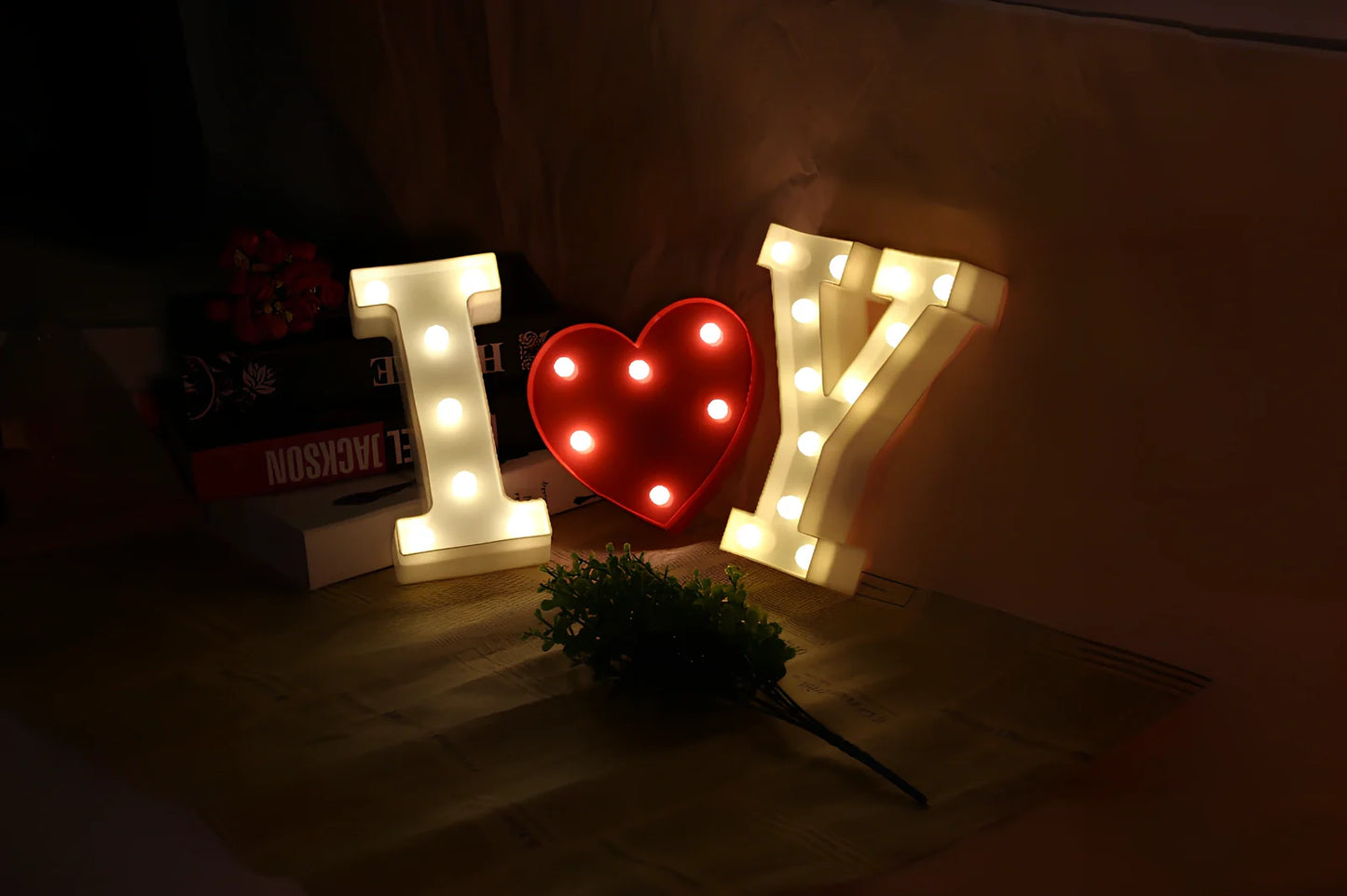 White plastic LED alphabet marquee sign with warm white illumination, 22cm height with battery operation