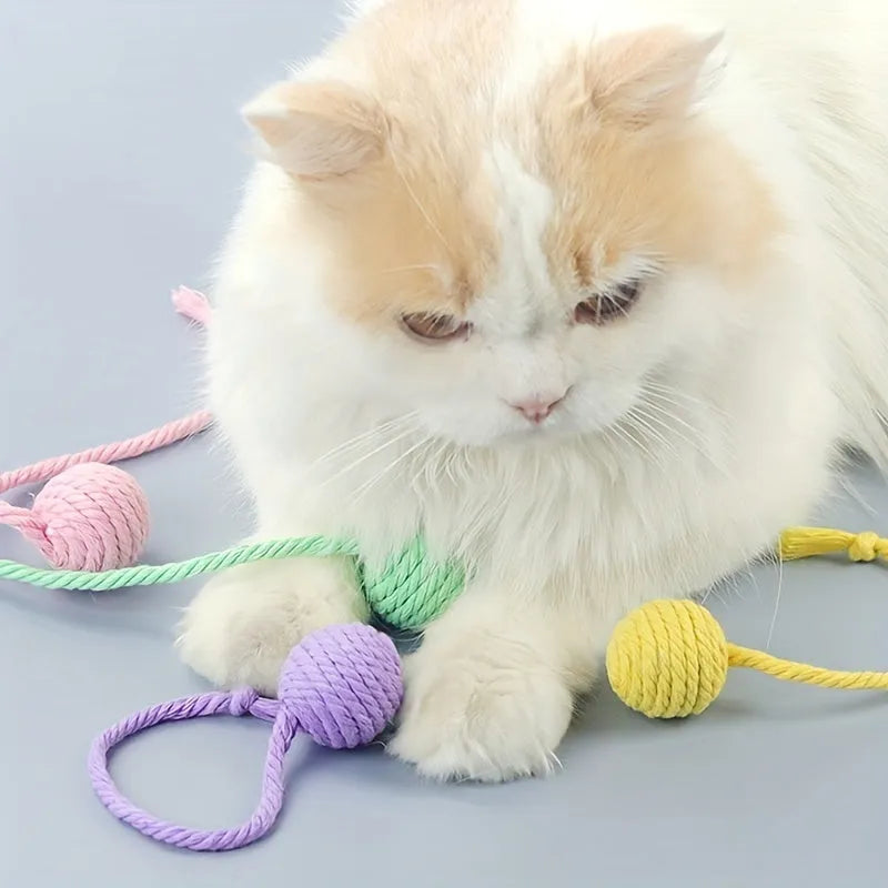Coloured cat toy ball with rope handle and internal bell in 6cm or 3cm sizes