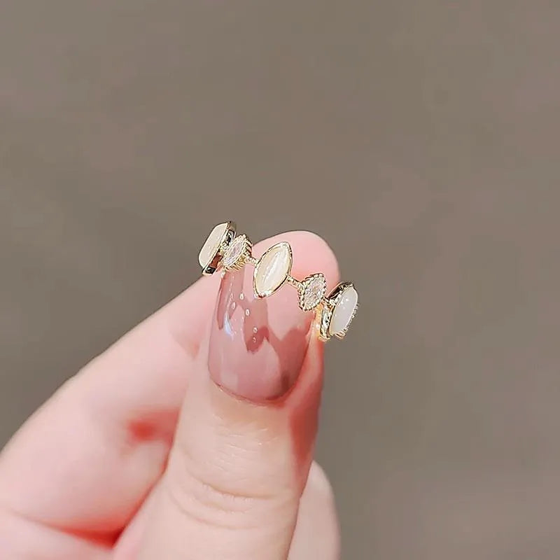 Copper geometric water drop ring for women with electroplated finish on white background