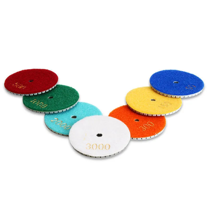 Set of 10 stone polishing pads showing different grits, 80mm diameter with 10mm centre holes