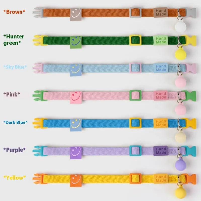 A stretchy, solid-colour polyester dog collar for small dogs, shown on an adjustable buckle.