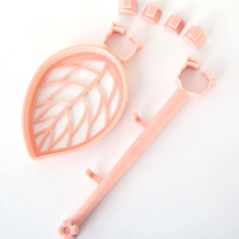 Clip-on adjustable sink drain basket in pink and light green, organising soap and towels