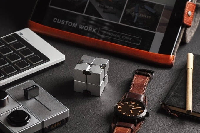 Infinity Cube Educational Toy in zinc alloy, available in multiple colours for focus enhancement and stress relief.