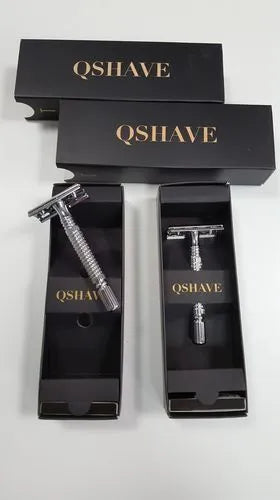 Double edged safety razor with closed comb head and chrome finish in storage box