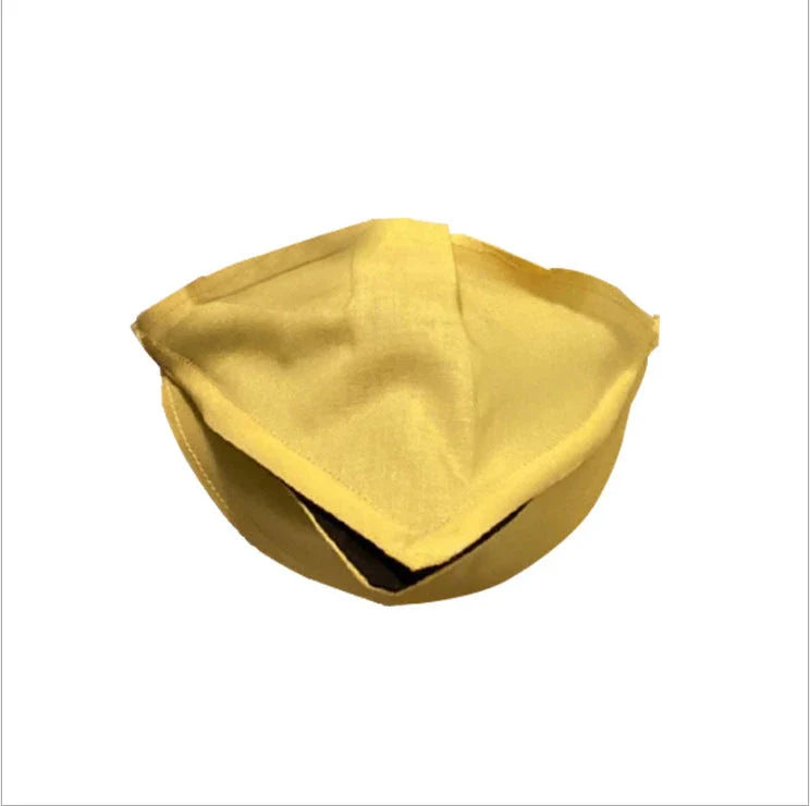 Handcrafted duck design face cover in absorbent cotton, available in black, red, and yellow