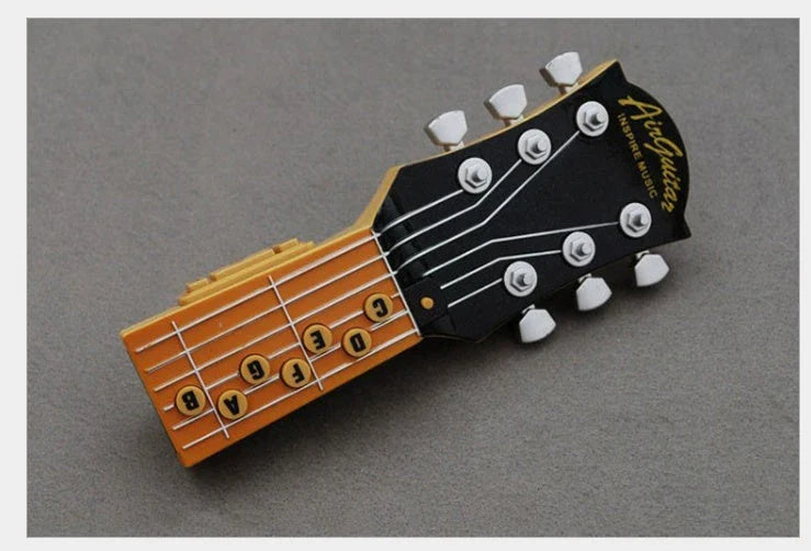 Compact infrared electronic guitar with chord buttons and tilt sensor in red, blue, or black