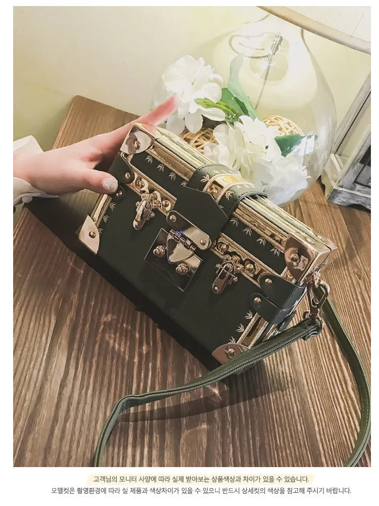 Hard PU women's shoulder bag with flap closure and cross body strap in black or green