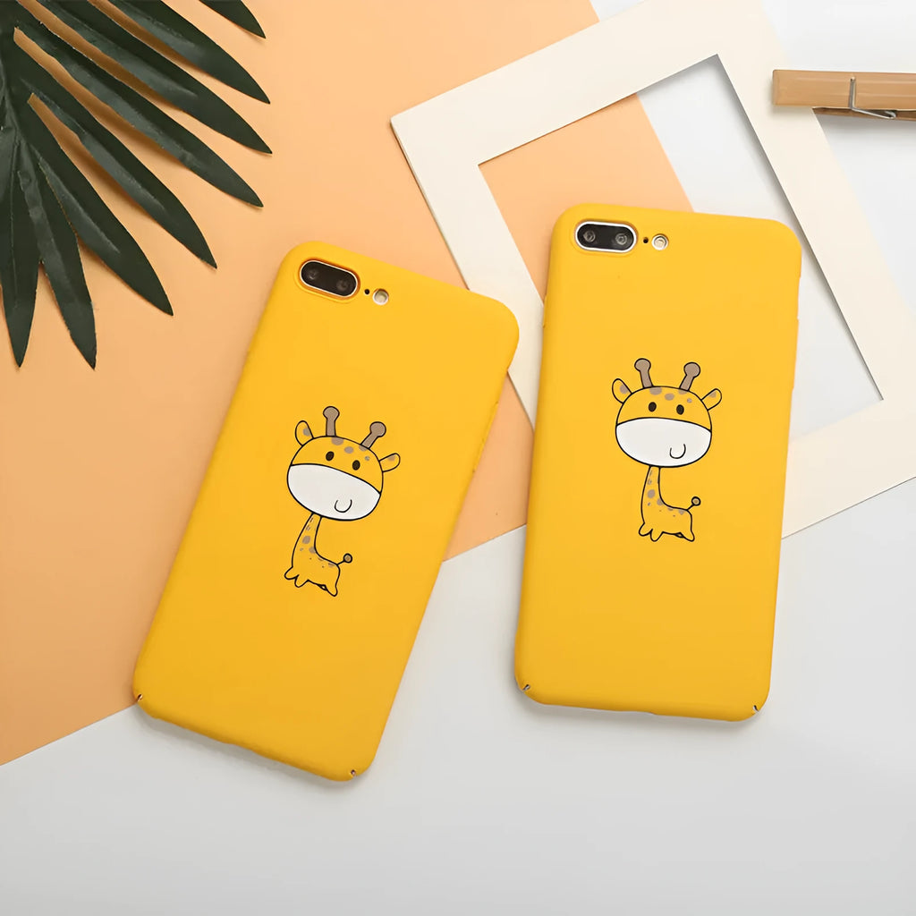 Yellow patterned hard plastic phone case for Apple iPhone models on a flat surface.