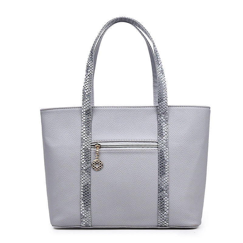 Elegant women's shoulder bag with zipper and organised pocket in light grey, black, off-white, and rose red