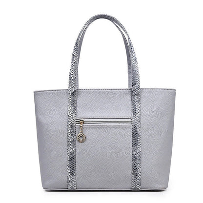 Elegant women's shoulder bag with zipper and organised pocket in light grey, black, off-white, and rose red