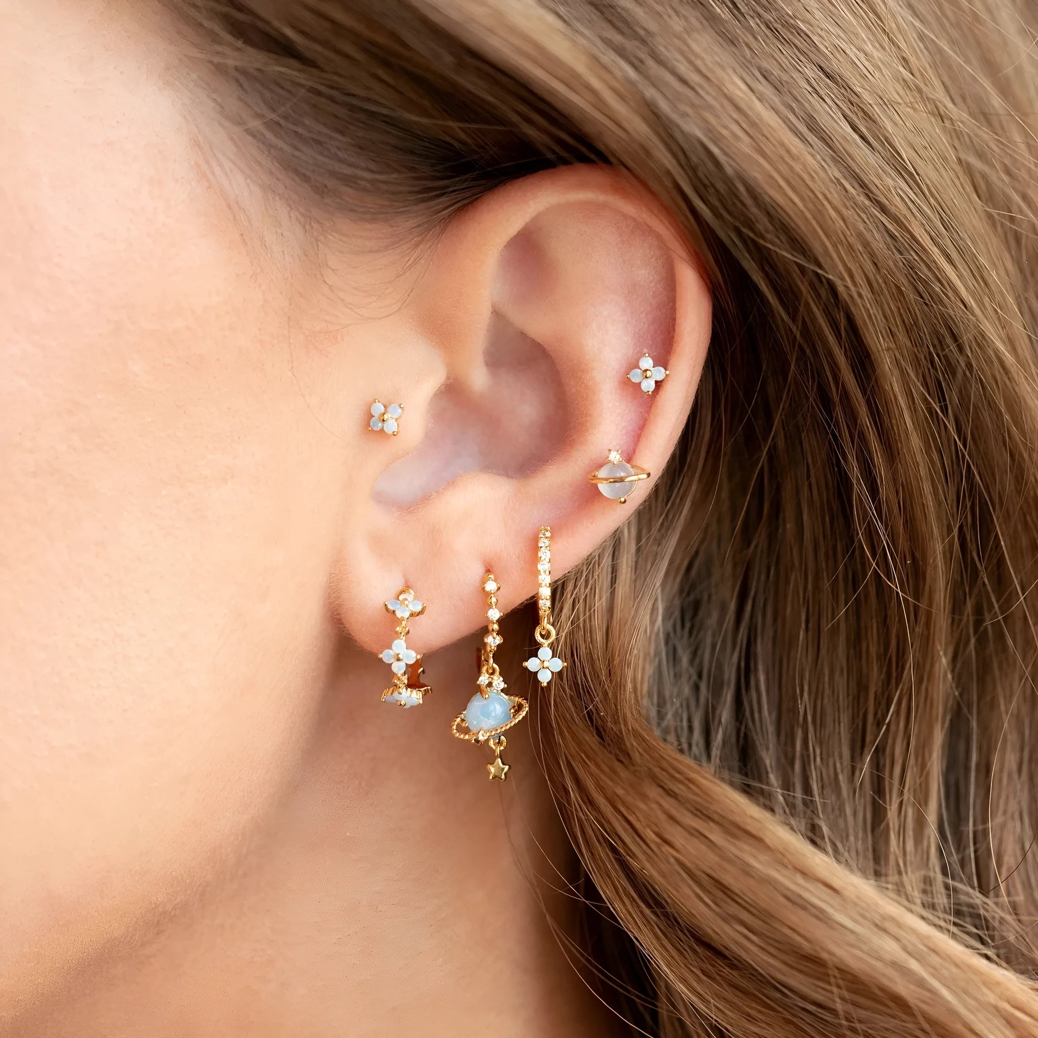 Gold and silver flower stud earrings with blue protein flower nail and zircon mosaic design.