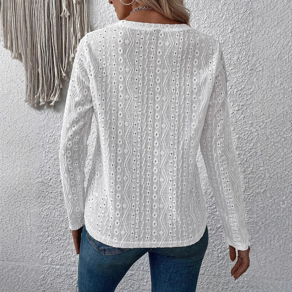 White loose fit long sleeve round neck polyester T-shirt laid flat.