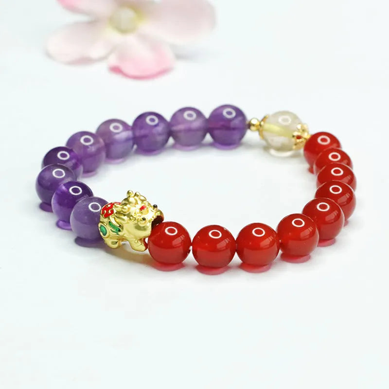 Amethyst and red agate Chinese style bracelet with 8mm round beads on an elastic string.