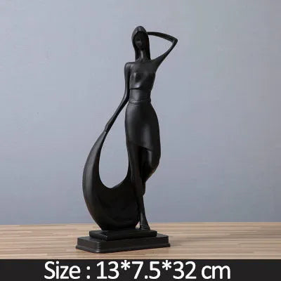 Resin abstract smart dancer sculpture in sub-white finish on a shelf, modern home decoration