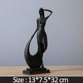 Resin abstract smart dancer sculpture in sub-white finish on a shelf, modern home decoration