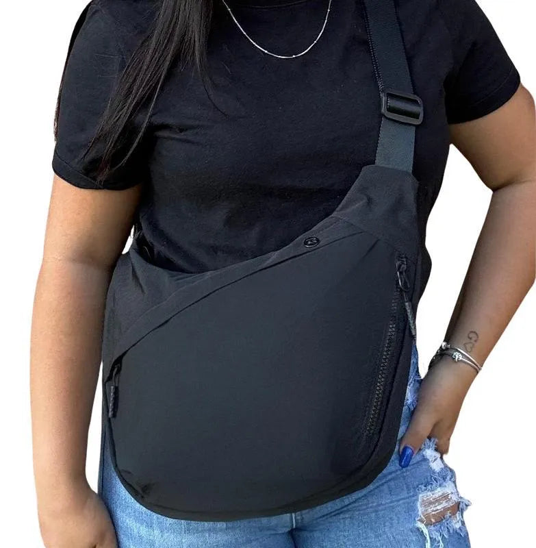 Men's PU canvas shoulder bag with adjustable strap in black, shown on a model for scale