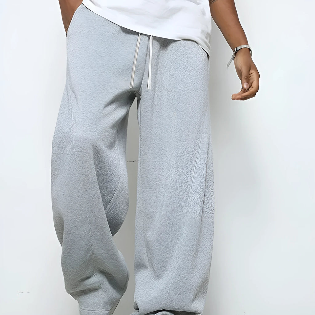 Men's straight-leg casual trousers in black with an elastic drawstring waistband.
