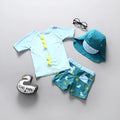 Light green dinosaur print children's nylon swimsuit with matching sun hat for boys