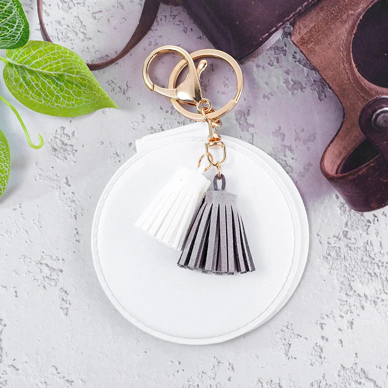 Mini round PU leather small mirror with tassel in various colours