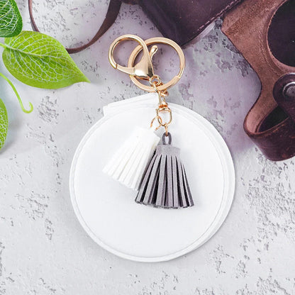 Mini round PU leather small mirror with tassel in various colours