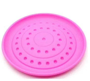 Rubber dog frisbee toy in green colour, showing soft plastic construction suitable for throwing and catching games with pets