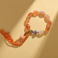 Jinsi jade agate Tibetan bracelet with carved lily flower motif and geometric shapes