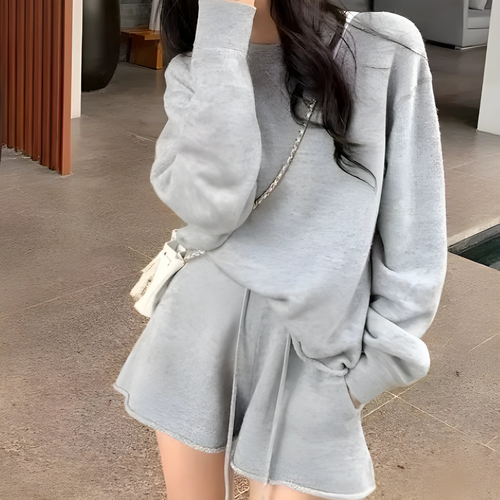 Women's loose-fit acrylic knit sweater and wide-leg shorts co-ord set in oatmeal colour.
