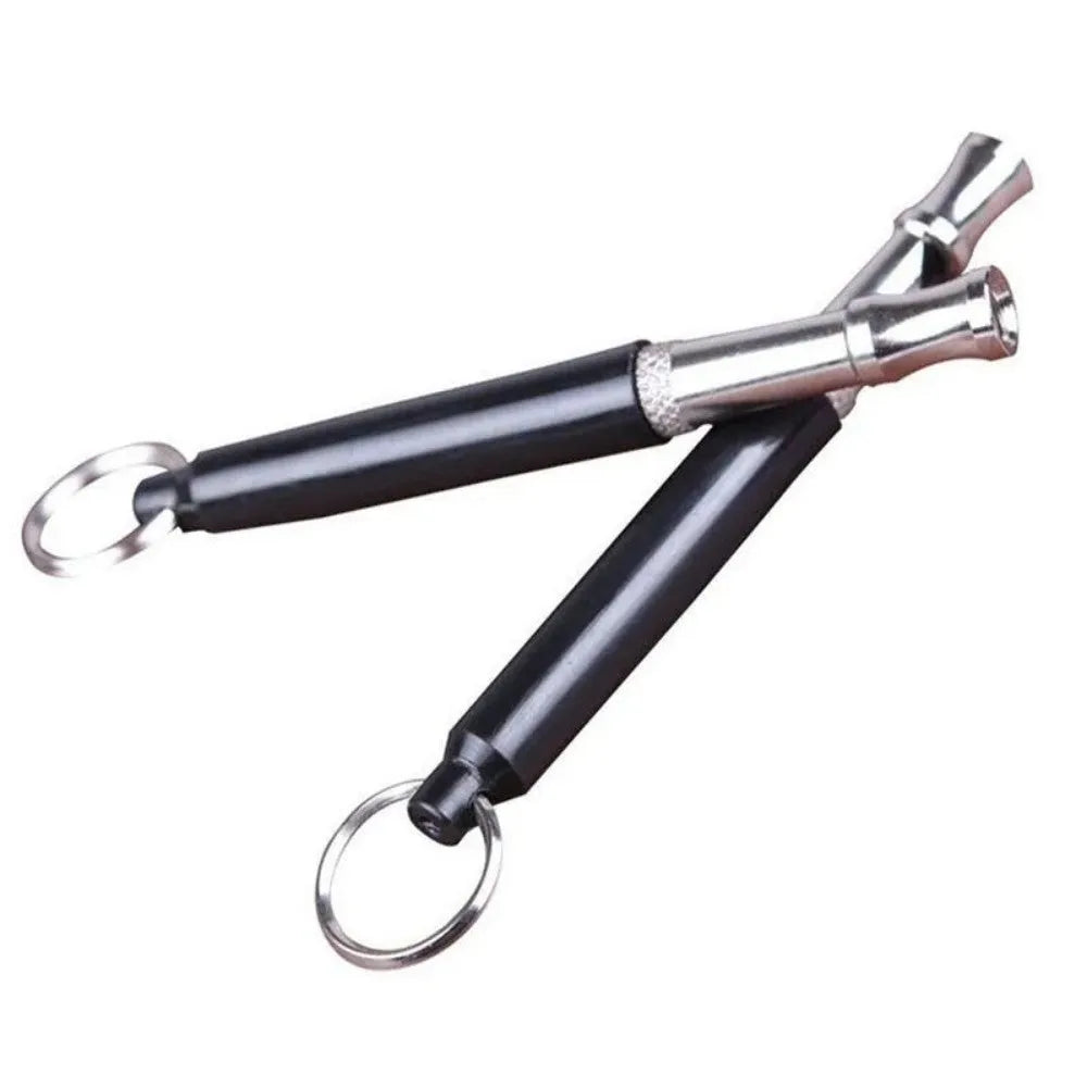 Copper ultrasonic dog training whistle with keychain ring and folding cord on white background