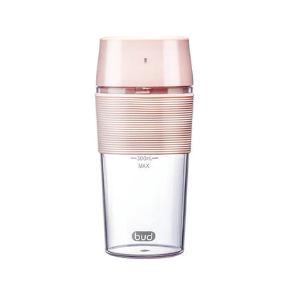 Wireless Charging Portable Mini Juicer Cup in pink and blue, compact and convenient for healthy juice on the go