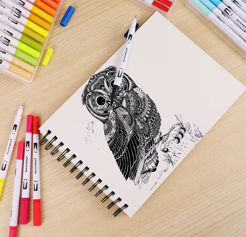Set of artist watercolour pens with brush tips arranged by colour, showcasing vivid inks.