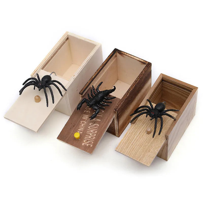 Wooden prank scare box closed on table, with random jumping animal surprise inside for April Fools' tricks.