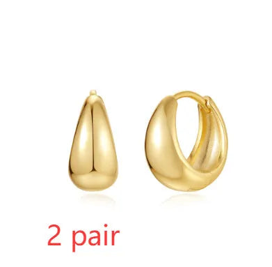 Geometric brass diamond earclip earrings with round elements in golden electroplated finish