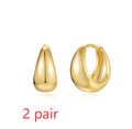 Geometric brass diamond earclip earrings with round elements in golden electroplated finish