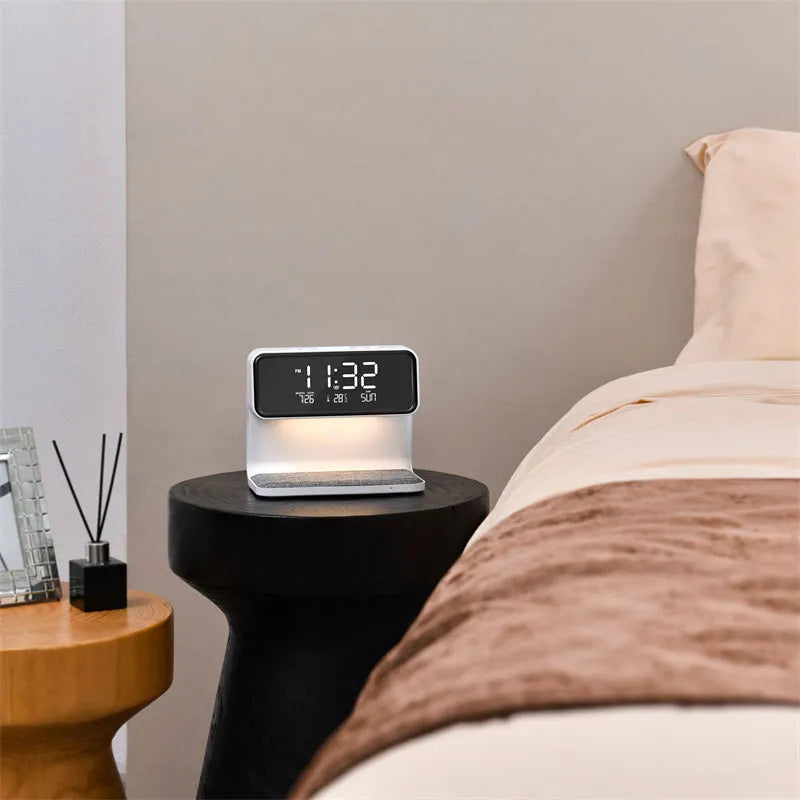 White 3-in-1 bedside lamp with wireless charging pad, LCD alarm clock screen, and touch-sensitive dimming control.