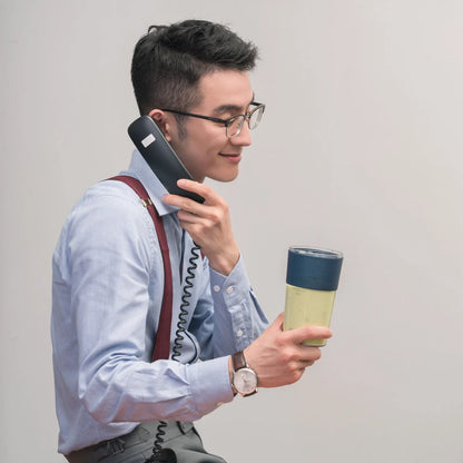 Wireless Charging Portable Mini Juicer Cup in pink and blue, compact and convenient for healthy juice on the go