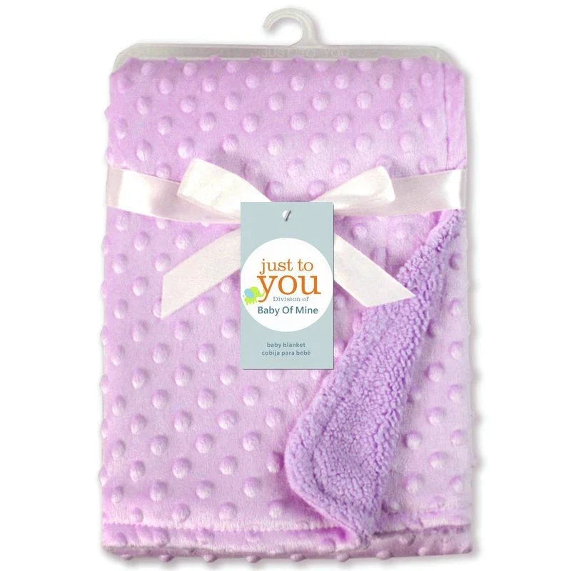 Soft and cozy baby blanket in various colors, including white, blue, gray, purple, green, and pink, with a plush, short-pile fabric and luxurious lamb velvet backing