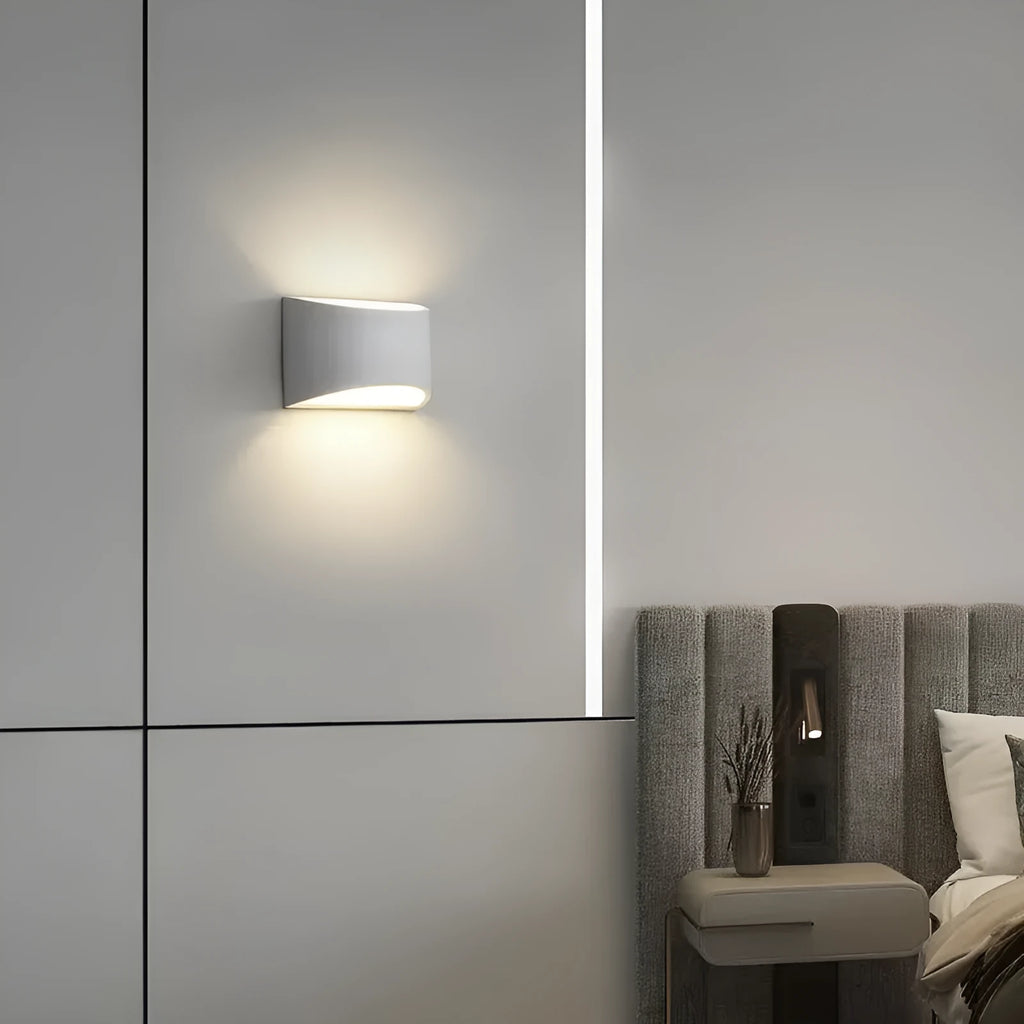 Simple Nordic plaster wall lamp with ABS shade mounted on a light-coloured wall