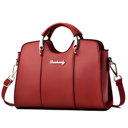 Women's shoulder bag with zipper closure measuring 28.5cm wide in wine red colour