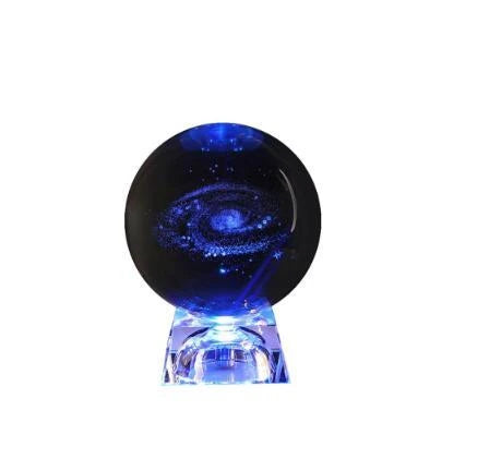 Mesmerizing Galaxy Crystal Ball made with premium K9 crystal, showcasing swirling celestial patterns and available in various sizes and base options.