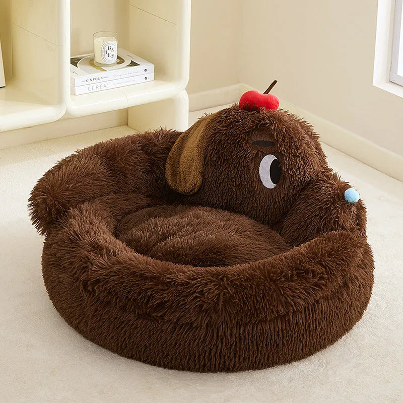 A grey plush sofa-style pet bed with high bolsters on three sides, shown in two sizes.
