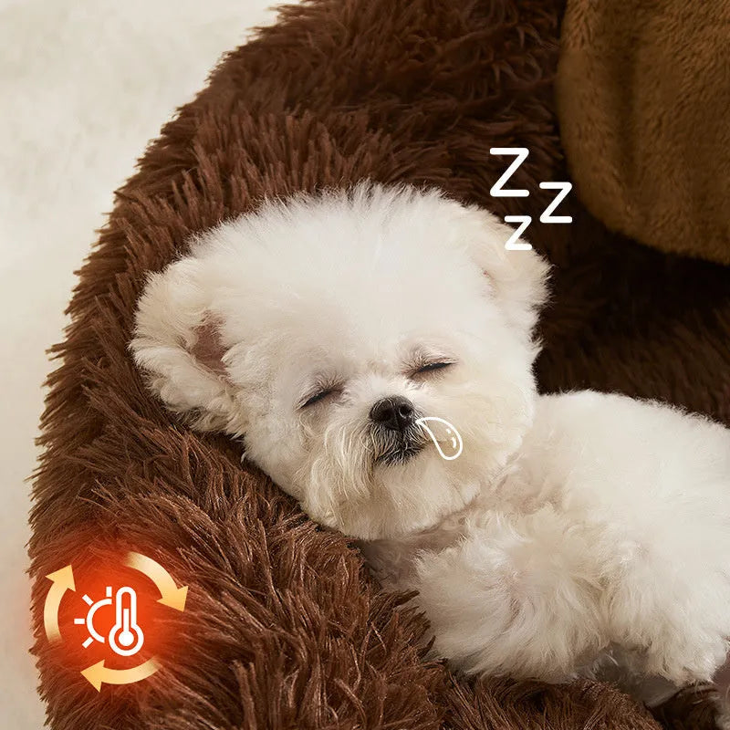A grey plush sofa-style pet bed with high bolsters on three sides, shown in two sizes.