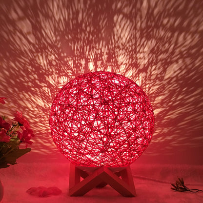 LED rattan table lamp with hand-knit lampshade in various colours