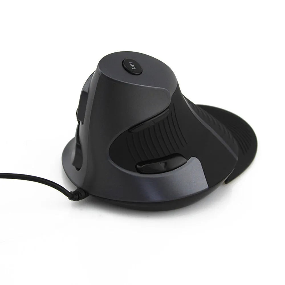 Black and white ergonomic vertical mouse with wired USB cable on a desktop.