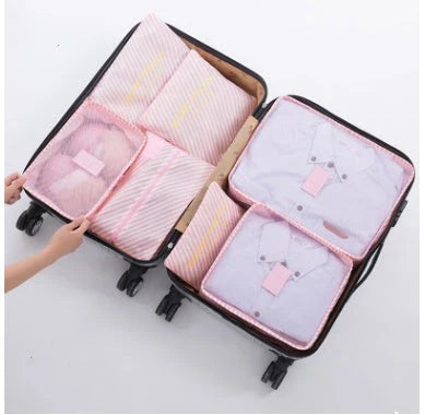 Durable waterproof packing cubes in various colors for organized, efficient travel