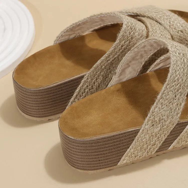Women's woven cross-strap platform sandal in beige with PU upper and rubber sole on a flat surface