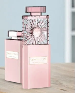 Pink perfume fan with USB charging port and compact design for personal fragrance diffusion