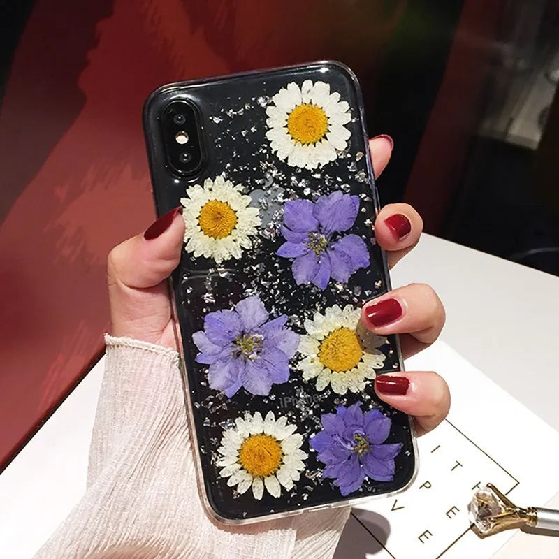 Handmade clear epoxy flower iPhone case with real dried flowers on soft TPU back cover.