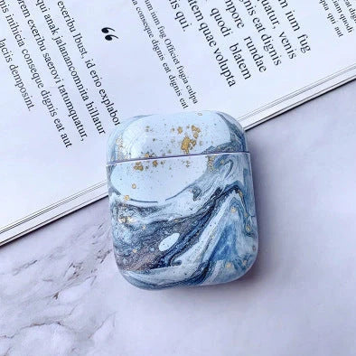 White marble pattern AirPods protective case with hard PC construction showing charging port access